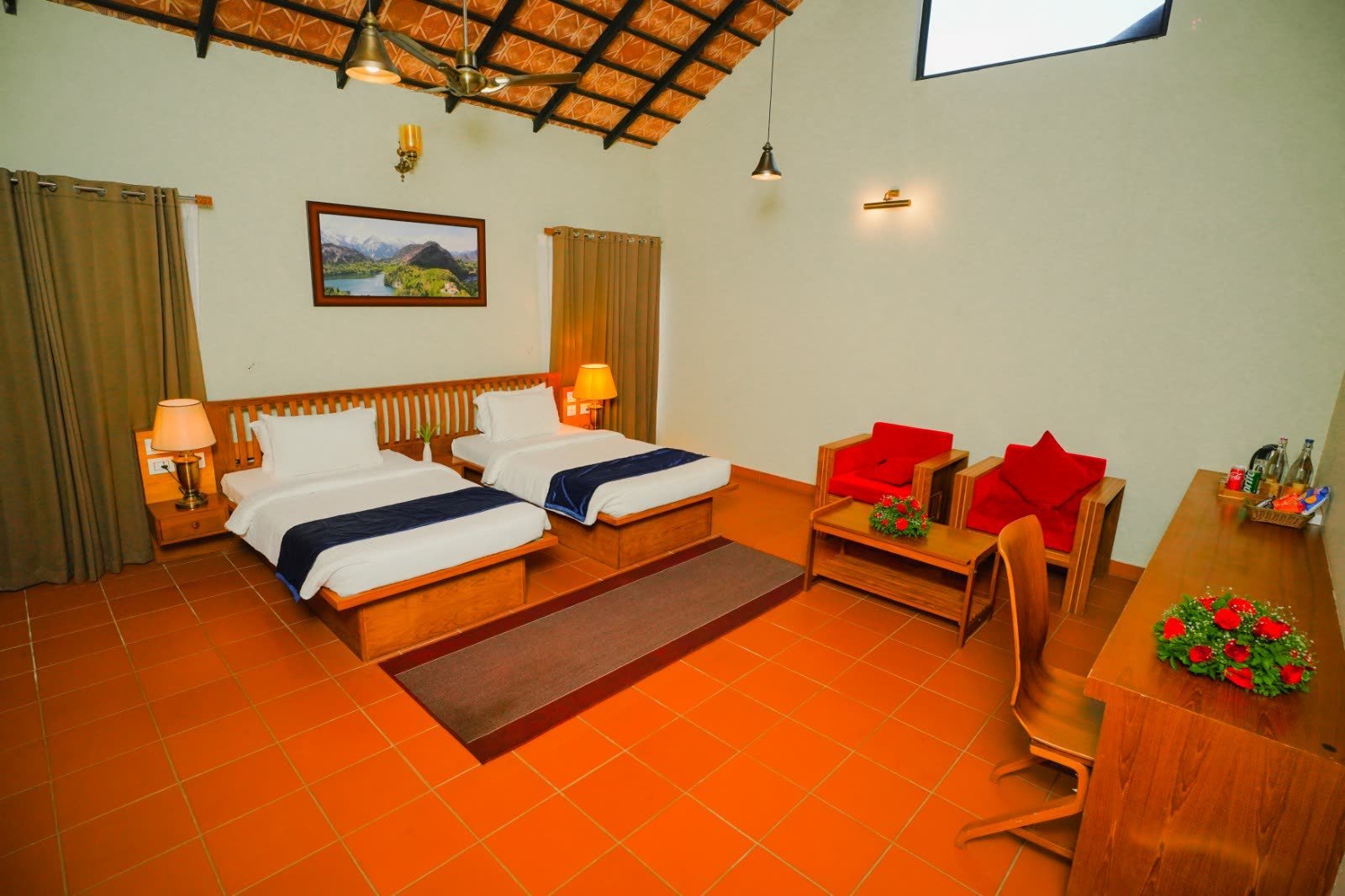 A second guest room at Vaidekam with warm flooring and garden light